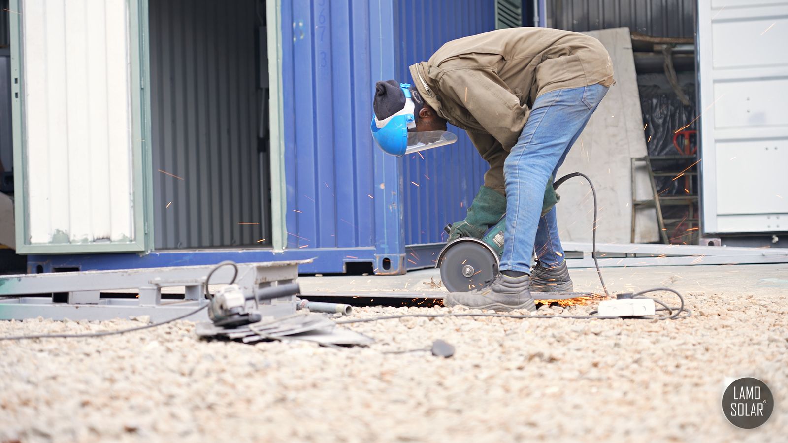 A Lamo Solar technician cutting steel on site
